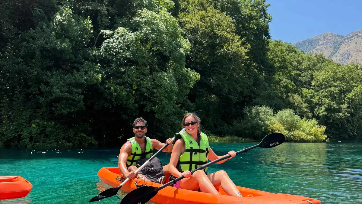 Kayaks and the wooden viewpoint on a flexible Blue Eye Albania tour from Saranda and Ksamil, southern Albania